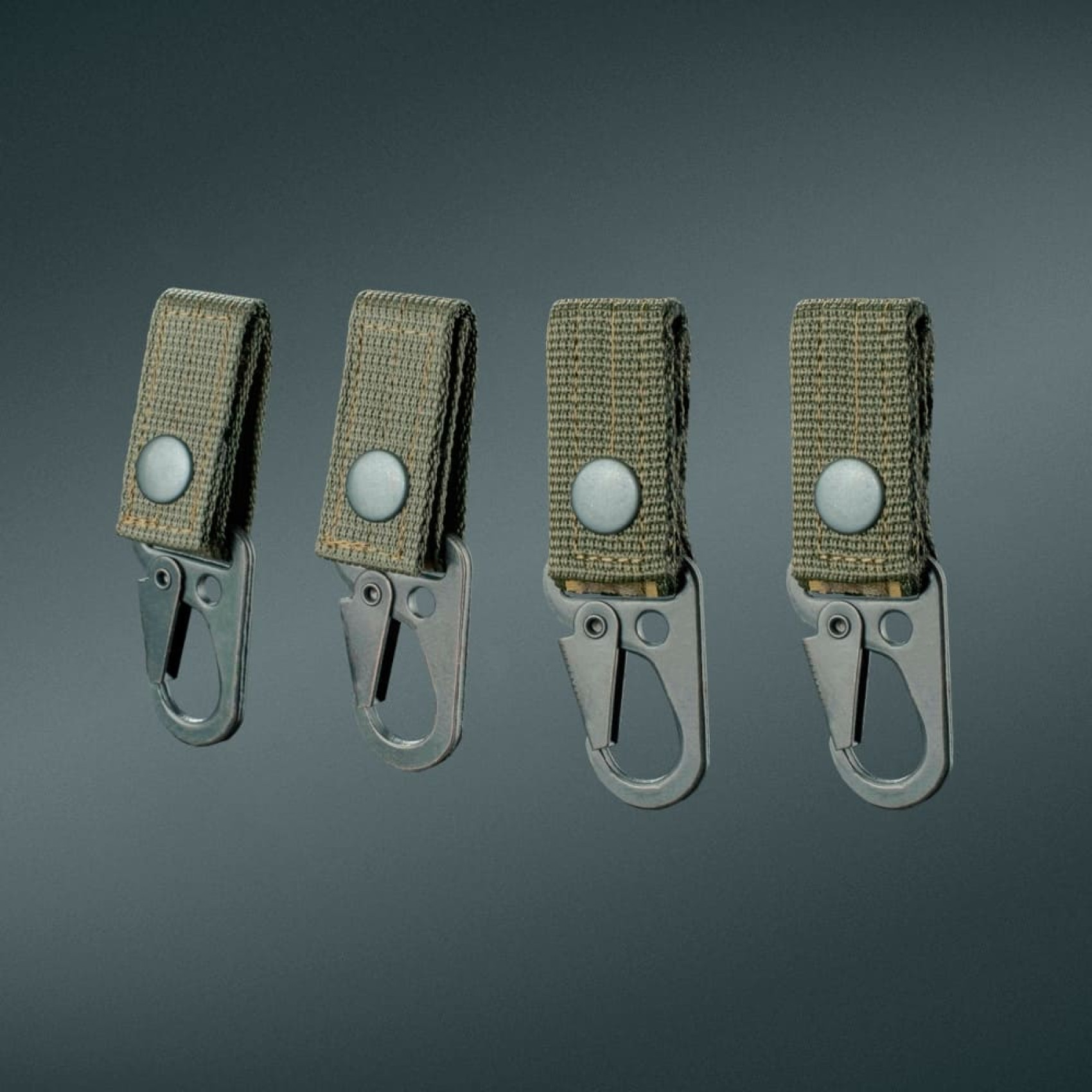 universalne-kriplennya-z-karabinom-na-knoptsi-def-ua-olyva-4-sht-1-1700x1700-1.jpg Universal carabiner attachment with button DEFua Olive (4pc) - Image 1